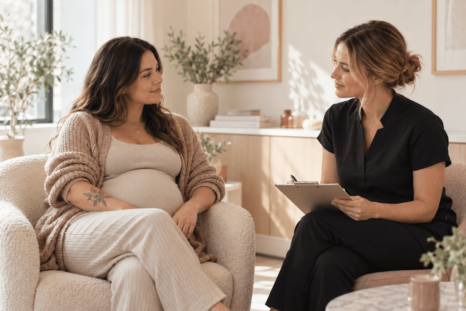 Pregnant adult with a healed forearm tattoo having a calm consultation before postponing laser tattoo removal